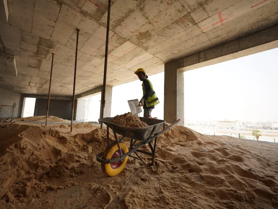Construction Site Worker Measuring