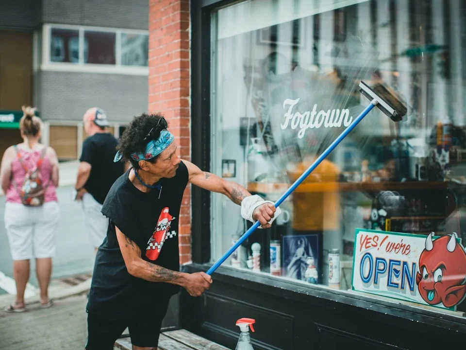 Person Cleaning Window Wiping Door