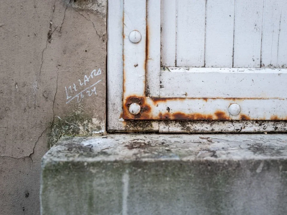 Rusty Screw Damaged Window